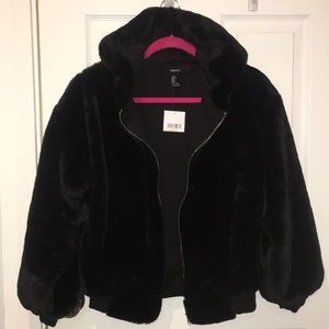 Short, black fur zip up jacket with a hood